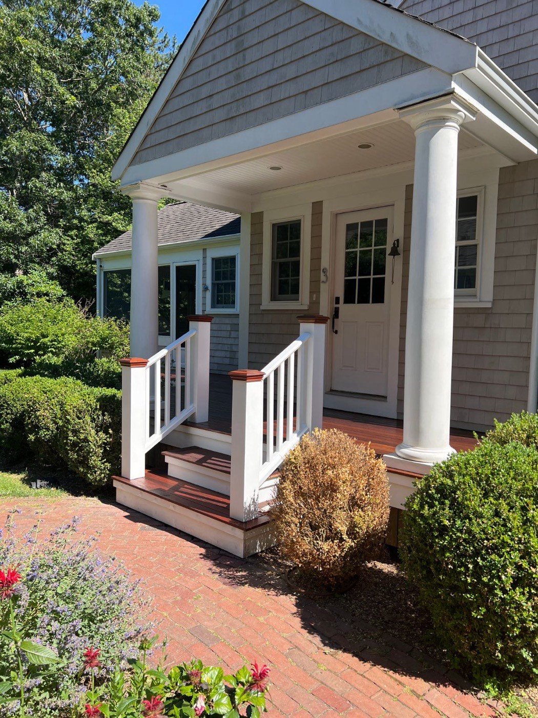 Front porch with columns built by Emerson Inc.