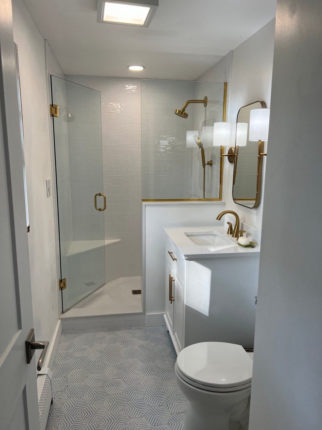 Bathroom remodel with glass shower and hex tile floor
